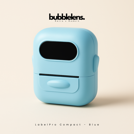 Blue label printer with 'bubble lens' branding on a beige background
