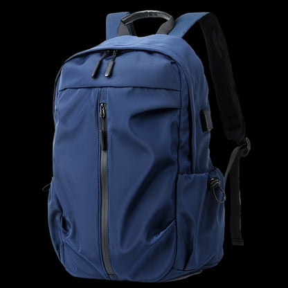 Blue backpack with black zippers on a white background