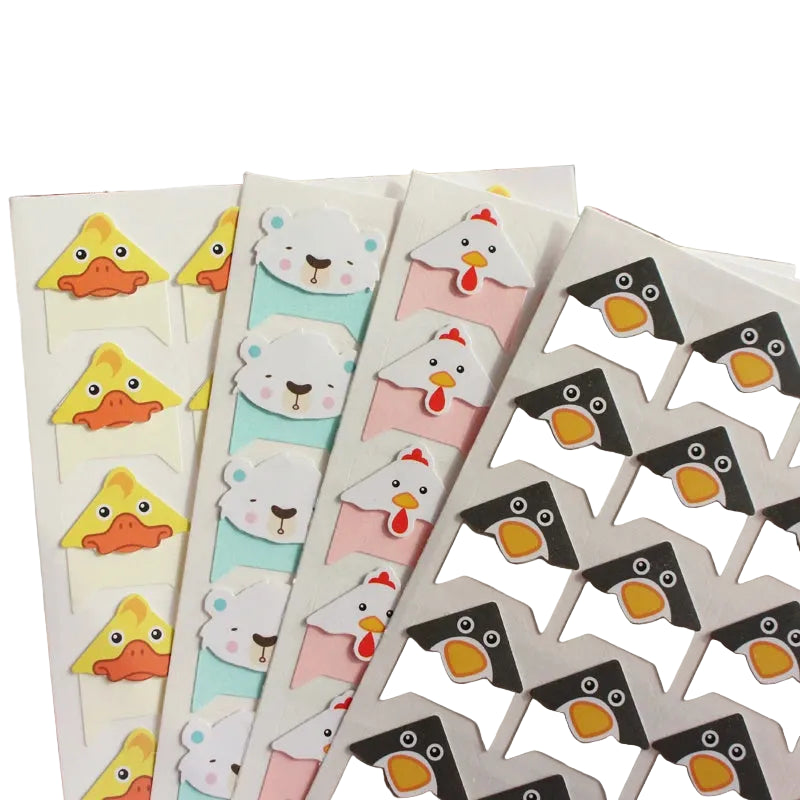Set of colorful animal-themed bookmarks on a blurred background