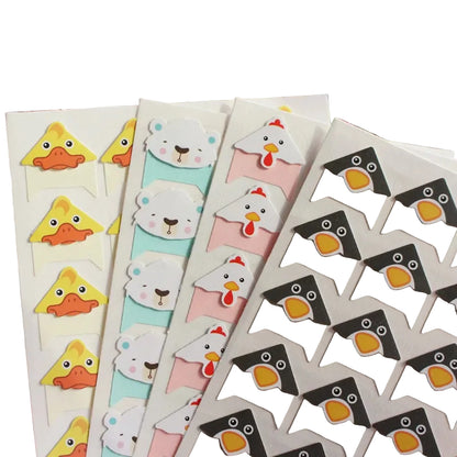 Set of colorful animal-themed bookmarks on a blurred background