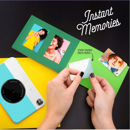 Person using instant photo paper with a Kodak camera on a colorful background