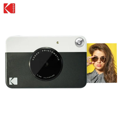 Kodak Printomatic camera with a woman wearing sunglasses on a yellow background