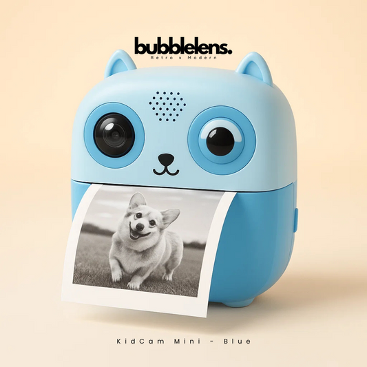 Blue bubble camera with a printed photo of a dog on a beige background, featuring the brand 'bubble lens'.